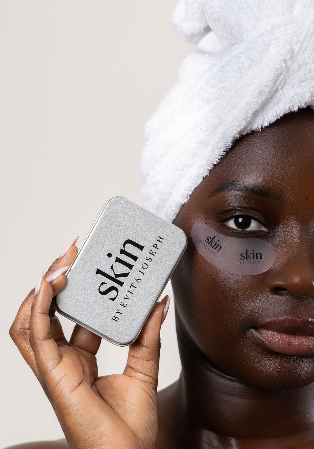 Person holding a skin by Evita Joseph Eye Mask