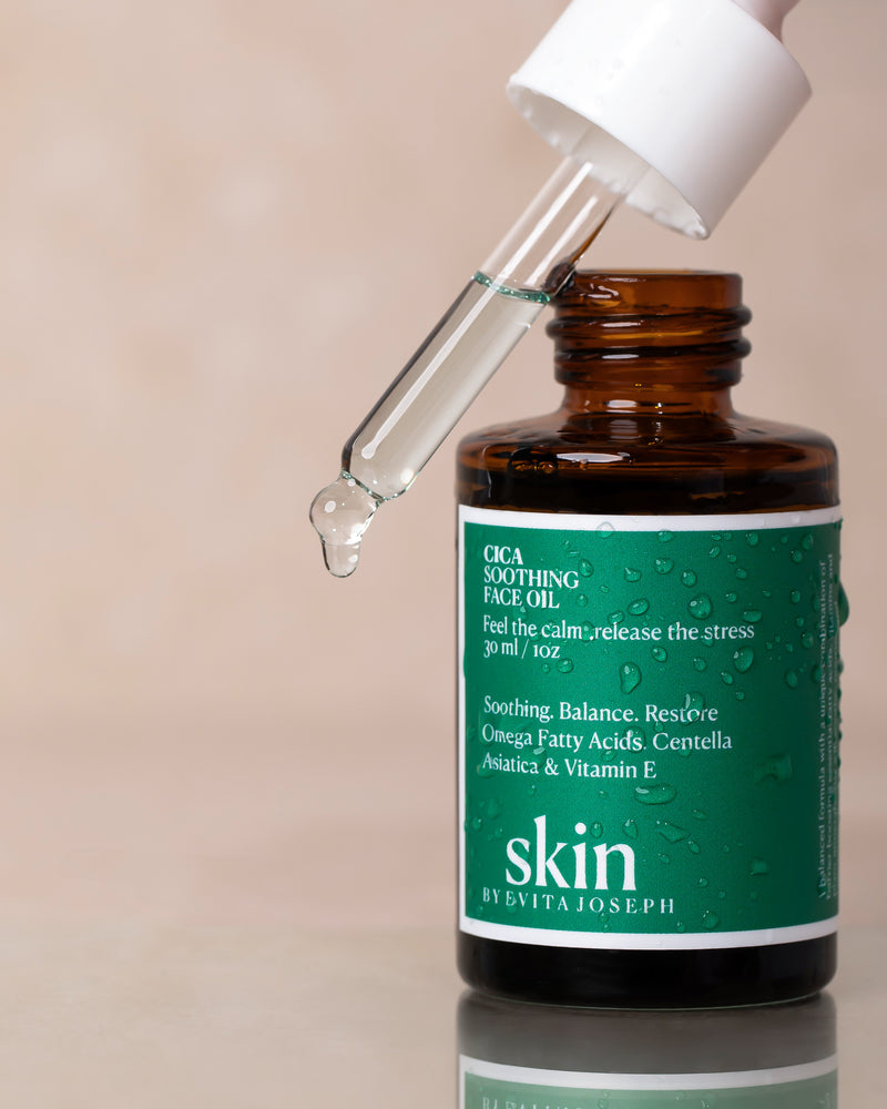 A bottle of Cica Soothing Face Oil with a dropper. Skin by Evita Joseph 